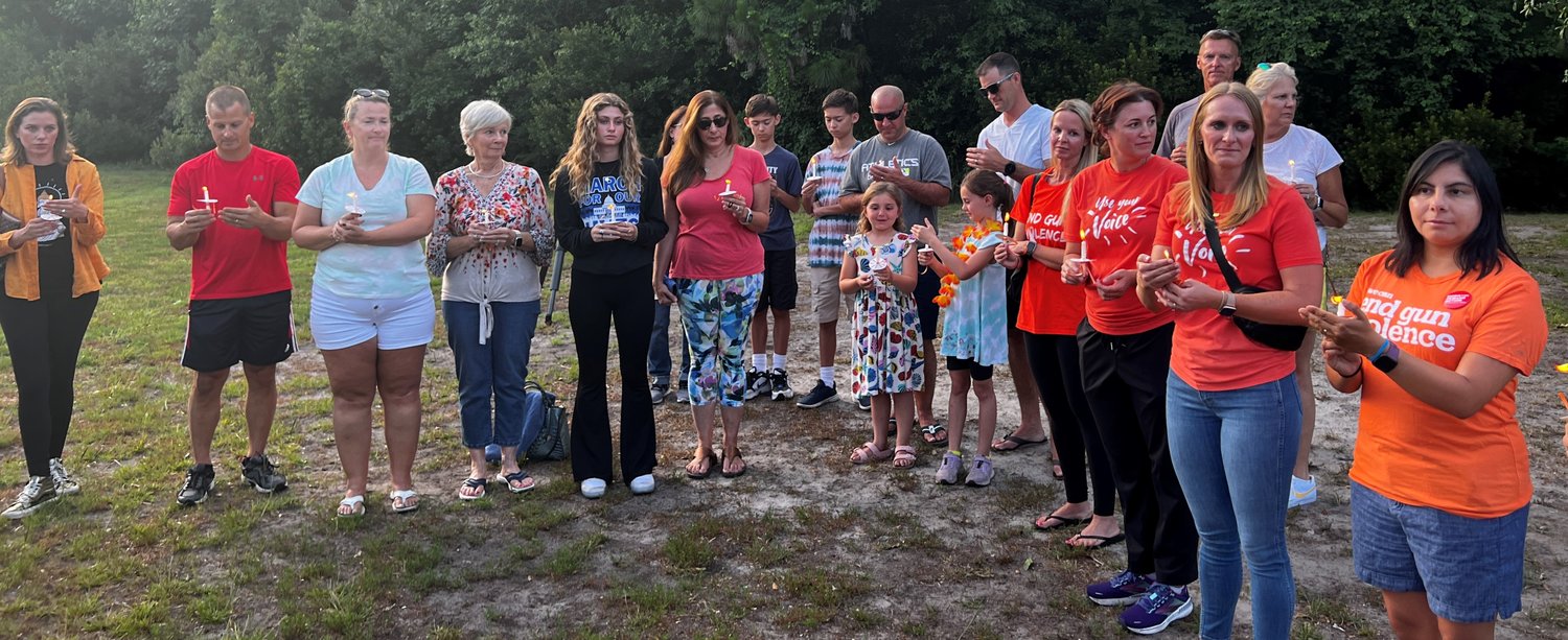 Area residents gathered at Davis Park on May 31 for a candlelight vigil following the recent shootings in Uvalde, Texas, and Buffalo, New York.